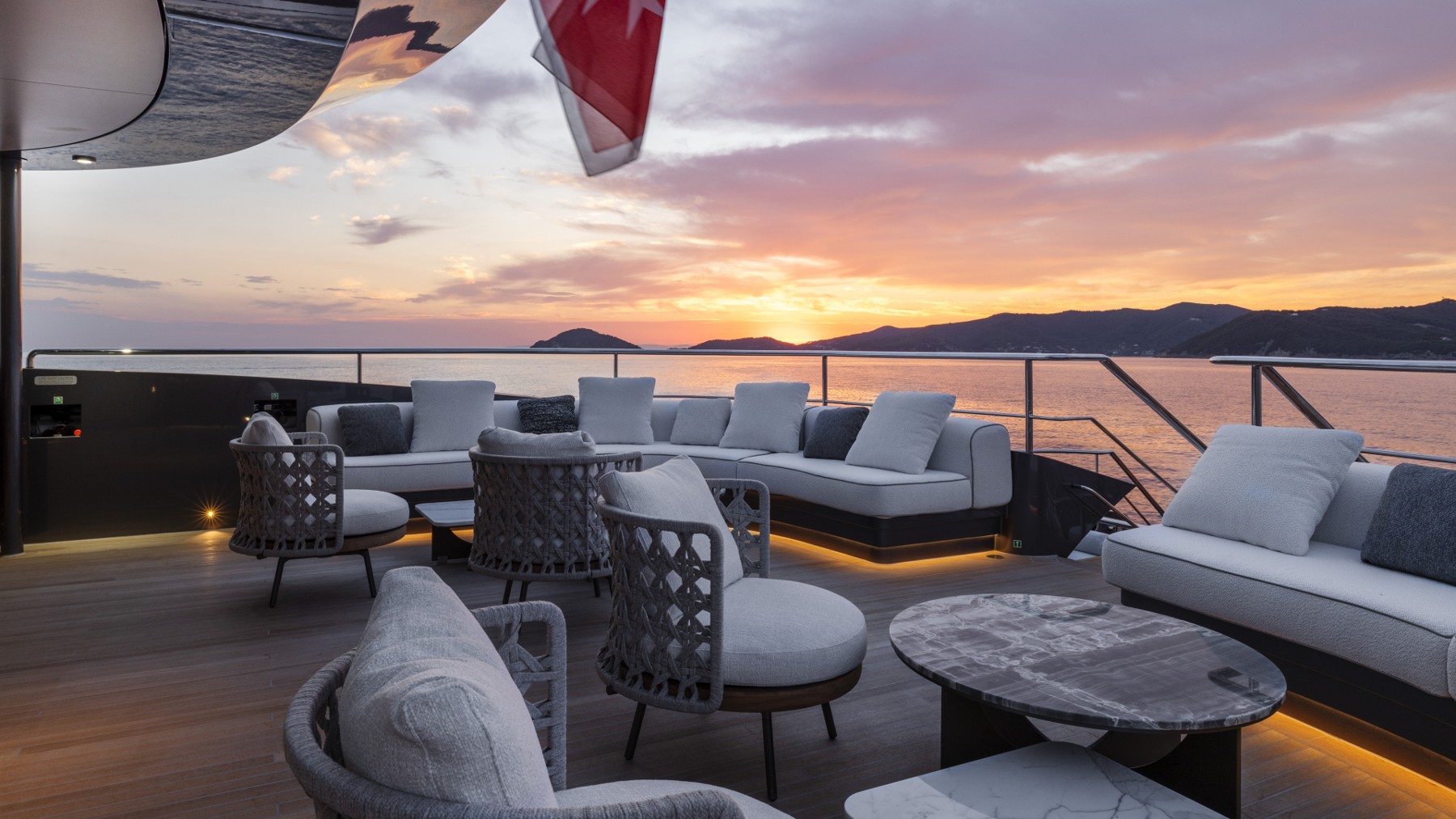 Superyacht sundeck lounge at sunset